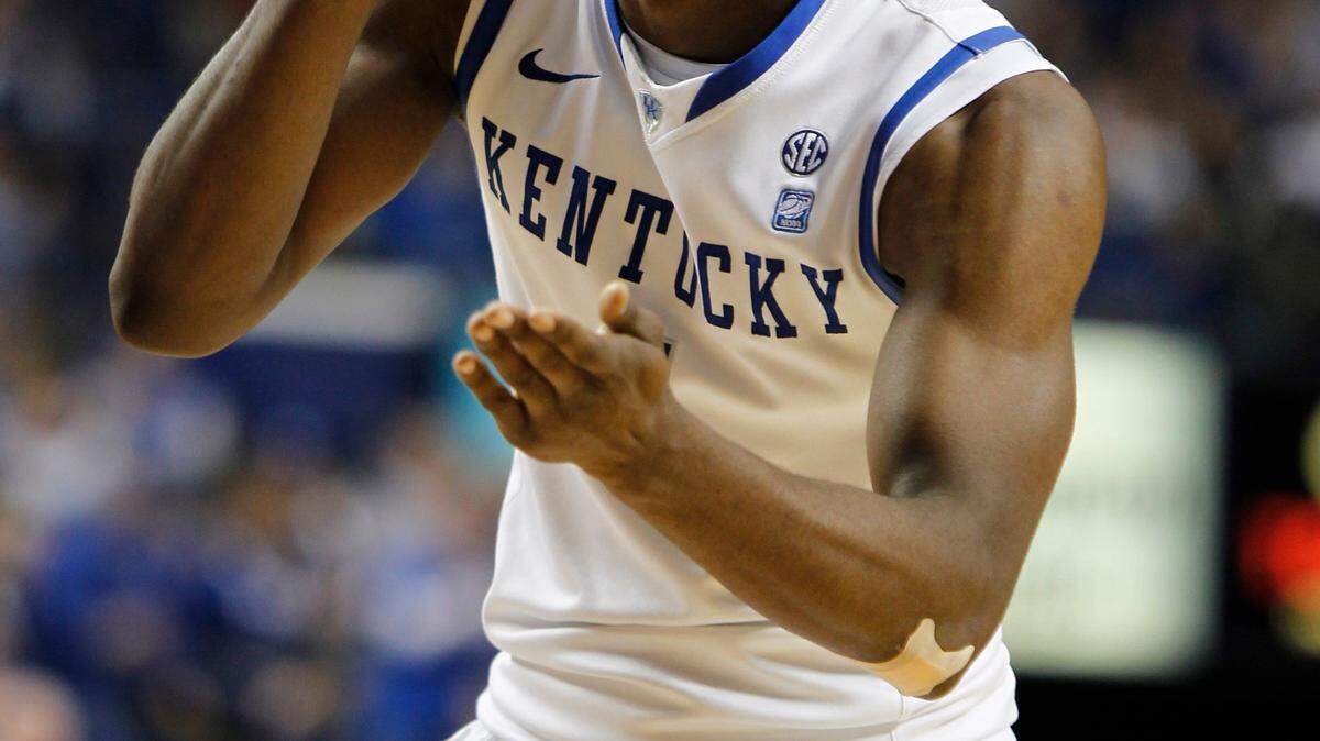 Darius Miller applauded a big play by Josh Harrellson against Tennessee. Miller, who had seven points and six rebounds, made some important plays of his own, especially on the glass.