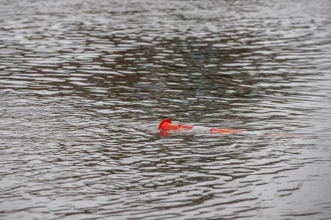 A traffic cone floats in water on flooded Richmond Road near the intersection with Midland Avenue in Lexington, Ky., on Thursday, July 1, 2021.