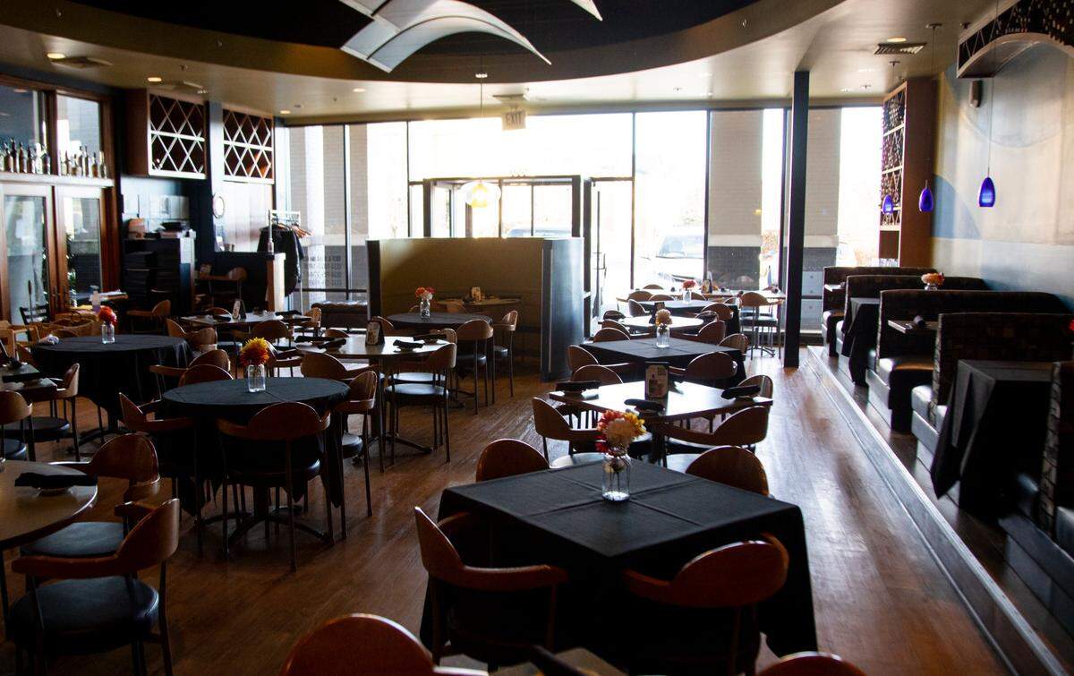Chairs and tables sit empty before Azur Restaurant and Patio opens for business Wednesday in Lexington. “New restrictions will be hard for a lot of local small businesses to stomach,” chef and owner Jeremy Ashby said.