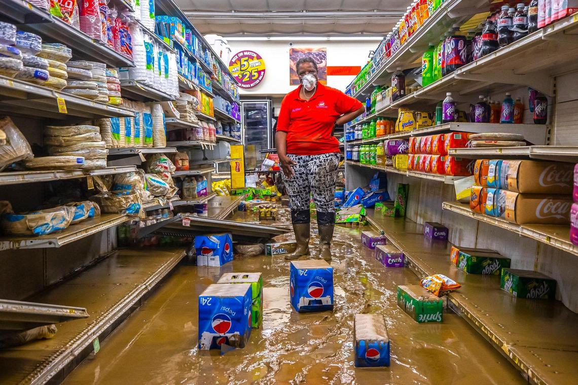 Gwen Christon stands in an aisle at the Isom IGA in Isom, Ky., Aug. 1, 2022, following devastating flooding in Eastern Kentucky. Christon began working at the store as a cashier months after it first opened in 1973. She now owns the store with her husband, Arthur. 