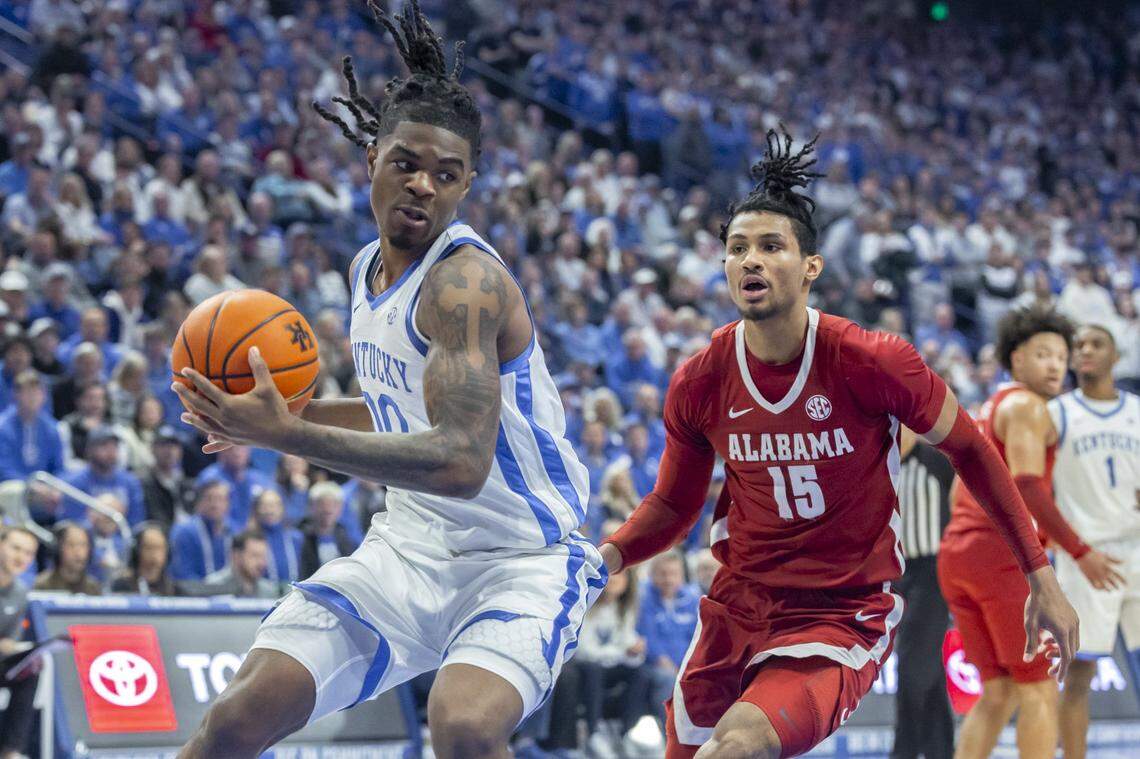 Kentucky guard Otega Oweh (00) looks to move the ball as Alabama forward Jarin Stevenson (15) defends during Saturday’s game at Rupp Arena.