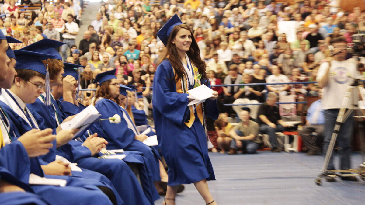 Breathitt County High School valedictorian Emily Tackett headed for the podium to deliver an address to her fellow graduates during the school's commencement ceremony in Jackson Friday. Tackett plans to study biology on a full scholarship to Union College.  
