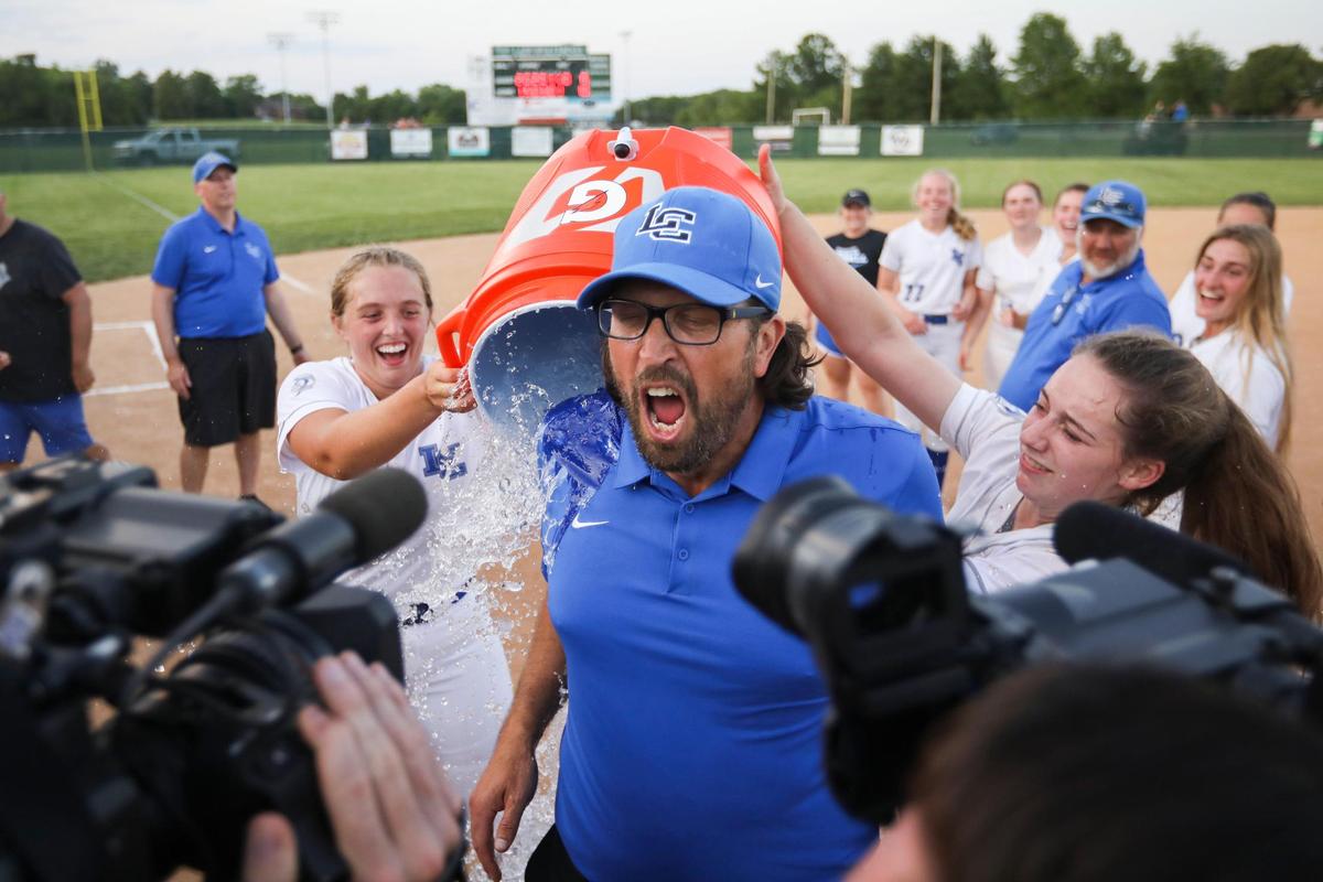Lexington Catholic head coach Emery Emmert gets an ice bath after the Knights defeated Lafayette on Wednesday night.