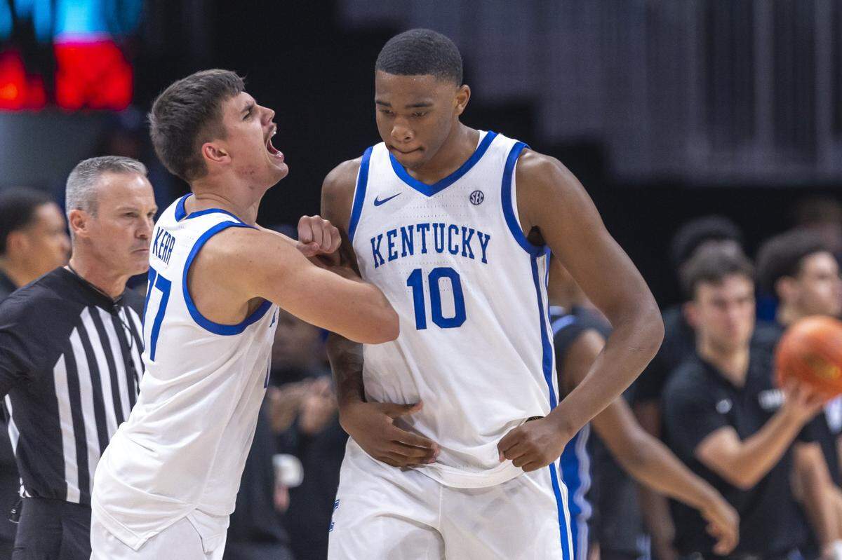 Kentucky guard Kerr Kriisa, left, congratulates Wildcats forward Brandon Garrison after a big play in the team’s 77-72 win over Duke in Atlanta last week.