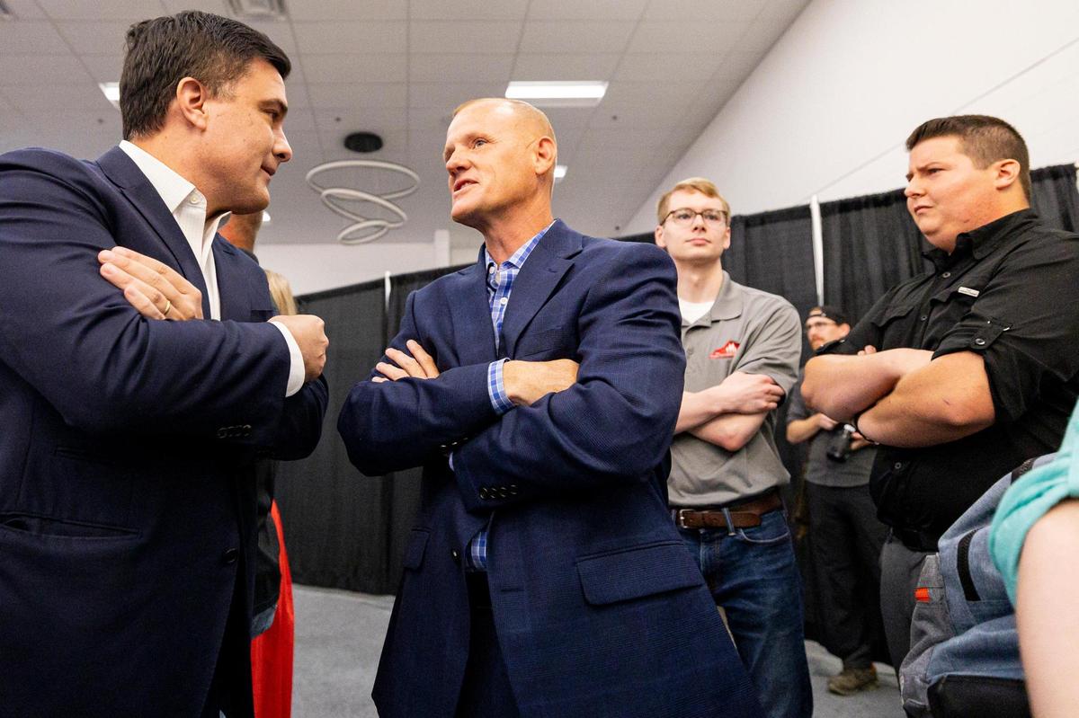 State Representative Josh Calloway, center, talks Nate Morris, left, during his campaign launch event on Monday, June 30, 2025, at Paroquet Springs Conference Center in Shepherdsville, Ky.