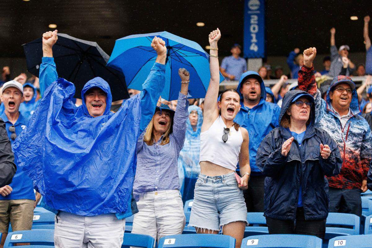 Kentucky fans cheer after outfielder Ryan Waldschmidt hit a home run during the ninth inning against Illinois on Saturday.