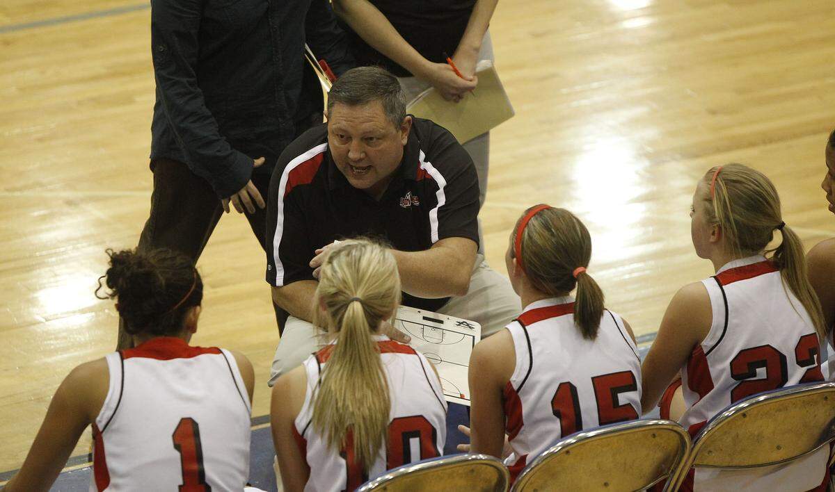 Perry County Central head coach Randy Napier talked to his team during a timeout at the 2010 Republic Bank Holiday Classic at Lexington Catholic. Napier, girls’ basketball’s all-time coaching wins leader, often took his team out of the mountains and around the state to prepare them for postseason play.