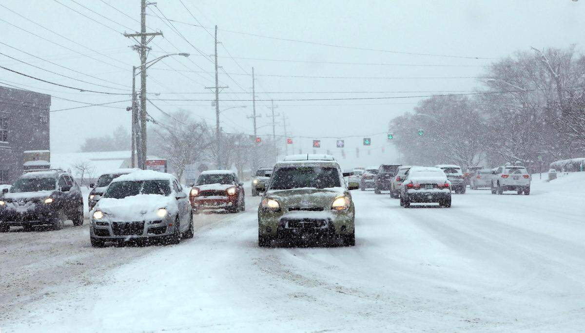 Traffic is backed up on Nicholasville Road at Southland Drive after Lexington received its first major snow of the winter season Jan. 6, 2022.