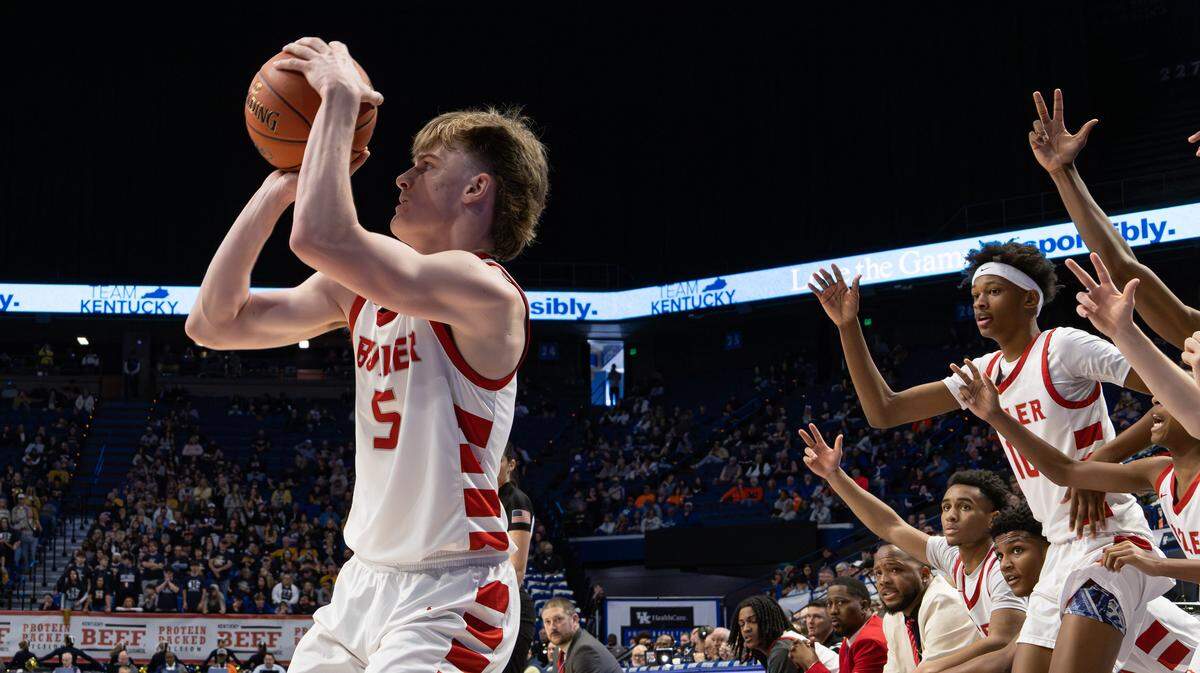 With feet planted, and encouragement coming from the team bench, Louisville Butler's Brayden Wilkins steadies himself to take the three-point shot during the UK HealthCare Boys' Basketball Sweet 16 state tournament first-round game between Louisville's Butler and Hazard at Rupp Arena in Lexington, Ky, on March 19, 2026.