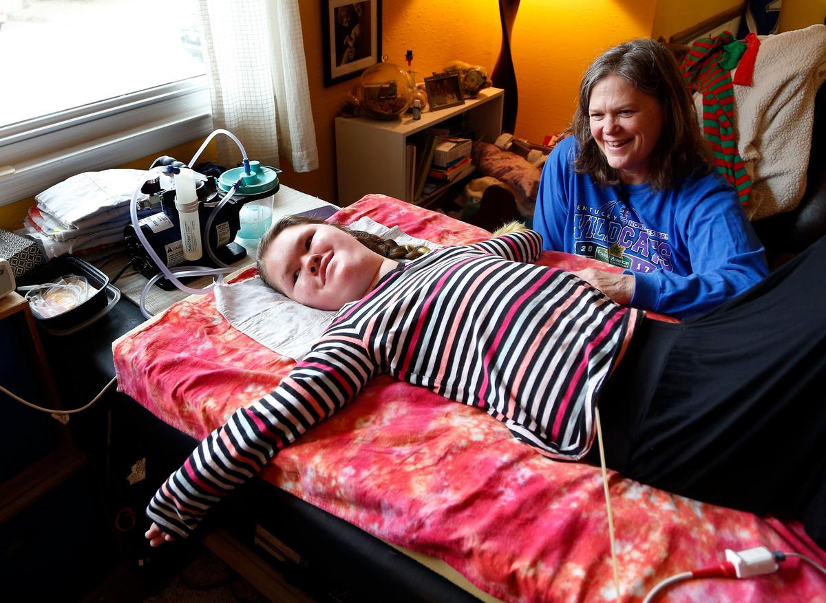 Danielle Pruitt, a freshman at Lafayette High School, with her mom Beth Pruitt on the right, took part in class Thursday afternoon via FaceTime from her home in Lexington. Danielle, who has Spinal Muscular Atrophy, has received Kentucky’s 2018 “Yes I Can” Award in academics and earned national recognition as well.