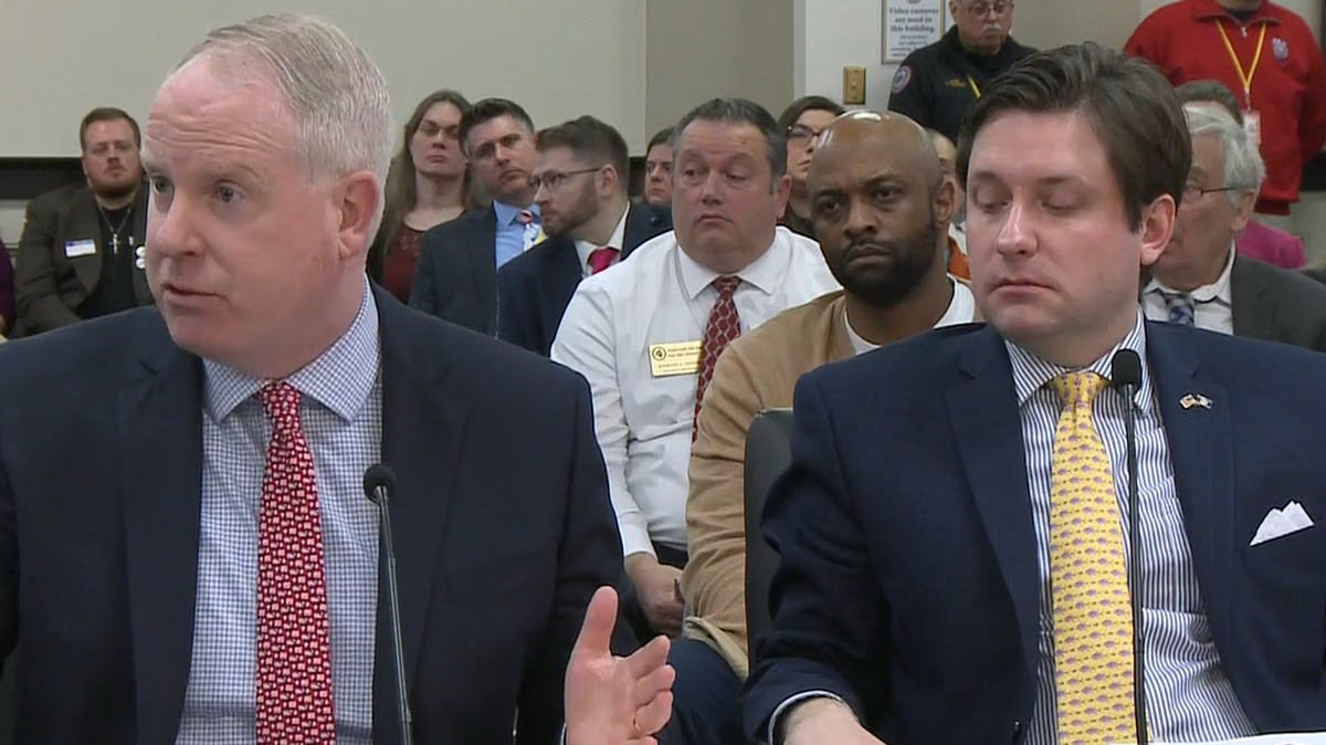 Joe Bilby (left), an attorney for the Kentucky House of Representatives, explains House Bill 468 to the House Judiciary Committee, while its sponsor, state Rep. Daniel Elliott (right), listens.