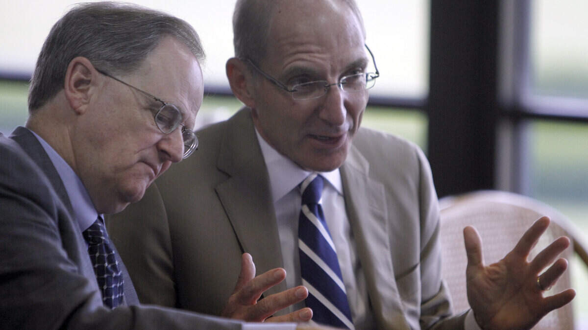 Retiring UK President Lee T. Todd Jr., left, talked with new UK President Eli Capilouto at the UK HealthCare retreat at Keeneland on Monday. Capilouto also attended a recent SEC meeting in Florida, where he met with UK Athletics Director Mitch Barnhart.