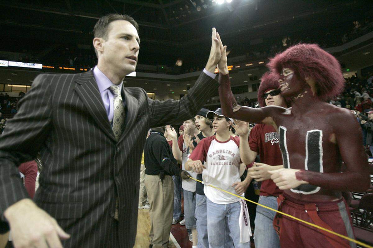 Darrin Horn high-fived a South Carolina fan after a Gamecocks victory. Horn, a Tates Creek High School graduate, won his first three games against UK as South Carolina head coach but lost his final five.