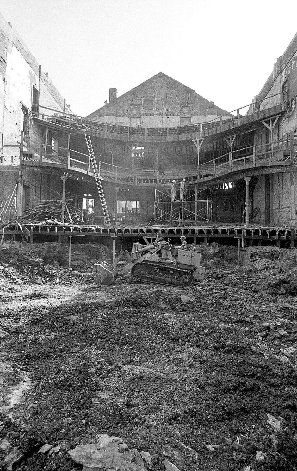 Don Williams rides a bulldozer Oct. 10, 1974 as the restoration of the Lexington Opera House continues in downtown Lexington. The historic theatre at the corner of West Short Street and South Broadway needed a renovation after high winds demolished the roof in 1973. Private and public fund drives started to save the theatre and ultimately it became part of the Lexington Center complex that included the new Rupp Arena and convention center that opened in 1976. Restoration of the 19th century structure cost $4 million. It reopened Friday, May 7, 1976 with a performance by the Lexington Philharmonic and the Lexington Singers.