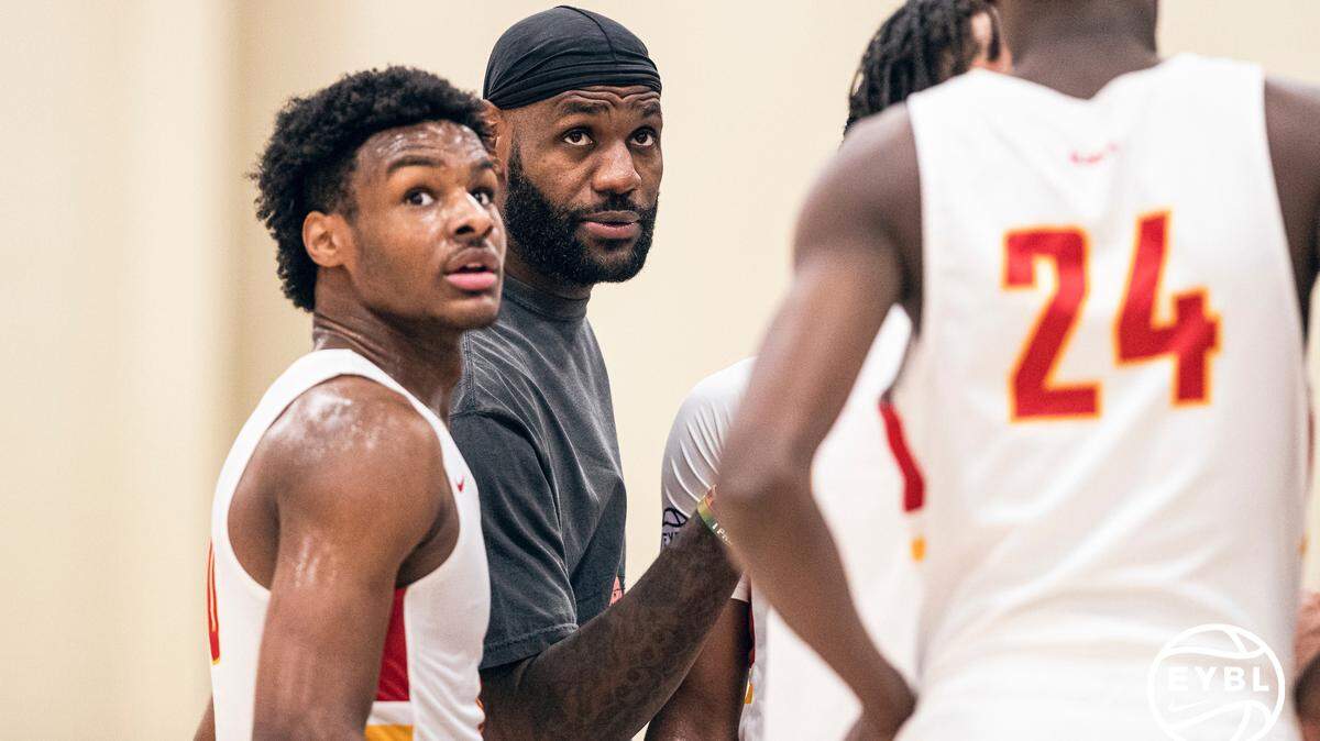 LeBron James talks with son Bronny James during a major Nike basketball event in July.