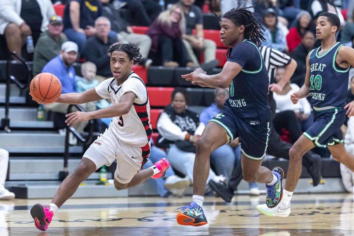 George Rogers Clark’s Malachi Ashford (3) drives the ball against Great Crossing’s LJ Holman (0) during their game in Winchester on Feb. 12.