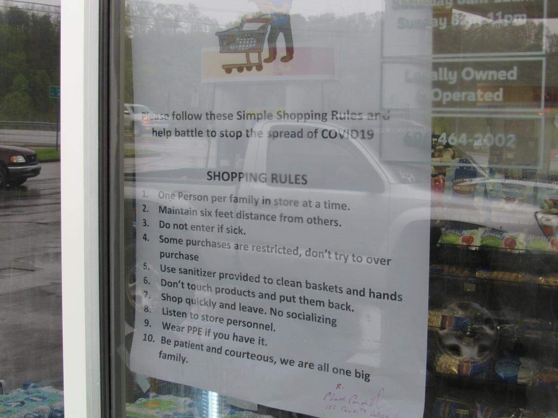 Stores in Beattyville had signs in their windows in April 2020 with social distancing guidelines.