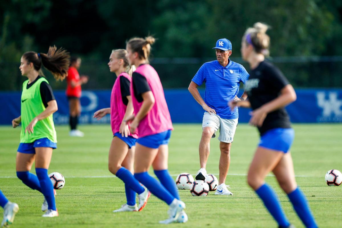 New Kentucky head coach Troy Fabiano watches his team warm up before Thursday night’s season-opening game against Ball State.