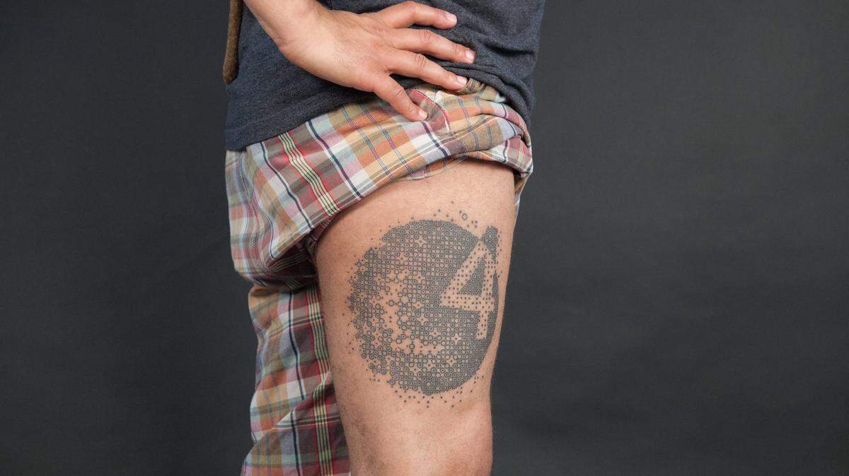 The entire inked project was revealed Friday night at a party of the Lexington Tattoo Project. The Lexingtonian who got the symbol tattooed on his body is Hendrick Floyd, husband of Bianca Spriggs, who wrote the poem that was split up and tattooed on the bodies of 254 project participants.