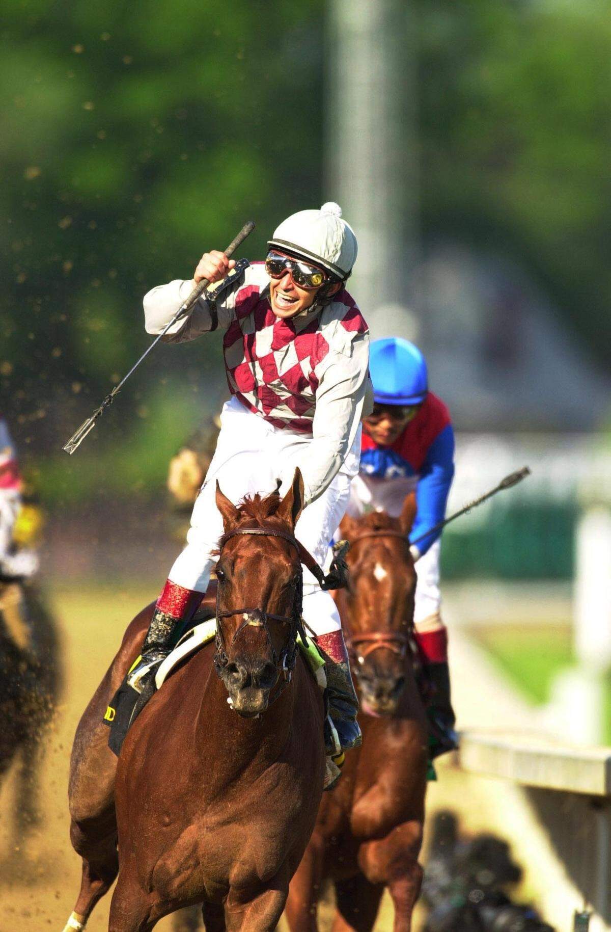 Funny Cide, with Jose Santos up, won the 2003 Kentucky Derby by 1 3/4 lengths over Empire Maker. Peace Rules finished third.