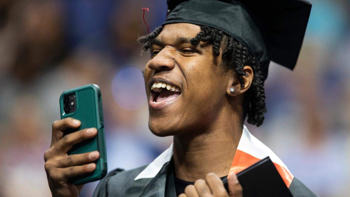 Graduates from Paul Laurence Dunbar celebrate after the school’s ceremony at Rupp Arena in Lexington, Ky., Tuesday, May 30, 2023.