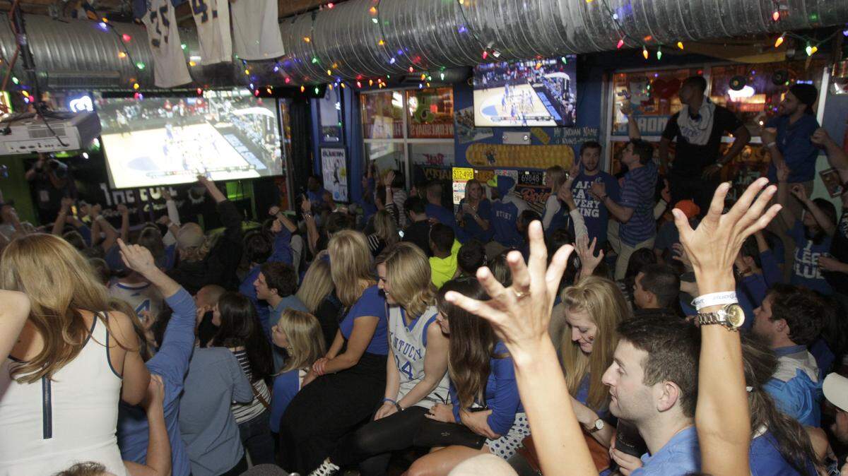 Kentucky fans crowded into The Tin Roof at South Limestone and West Maxwell Street March 28 to watch the Wildcats beat Louisville en route to a spot in the Final Four.