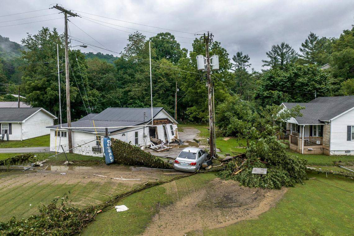 Flash flooding damaged structures and a vehicle near the Whitesburg Middle School football field in Whitesburg, Ky. 