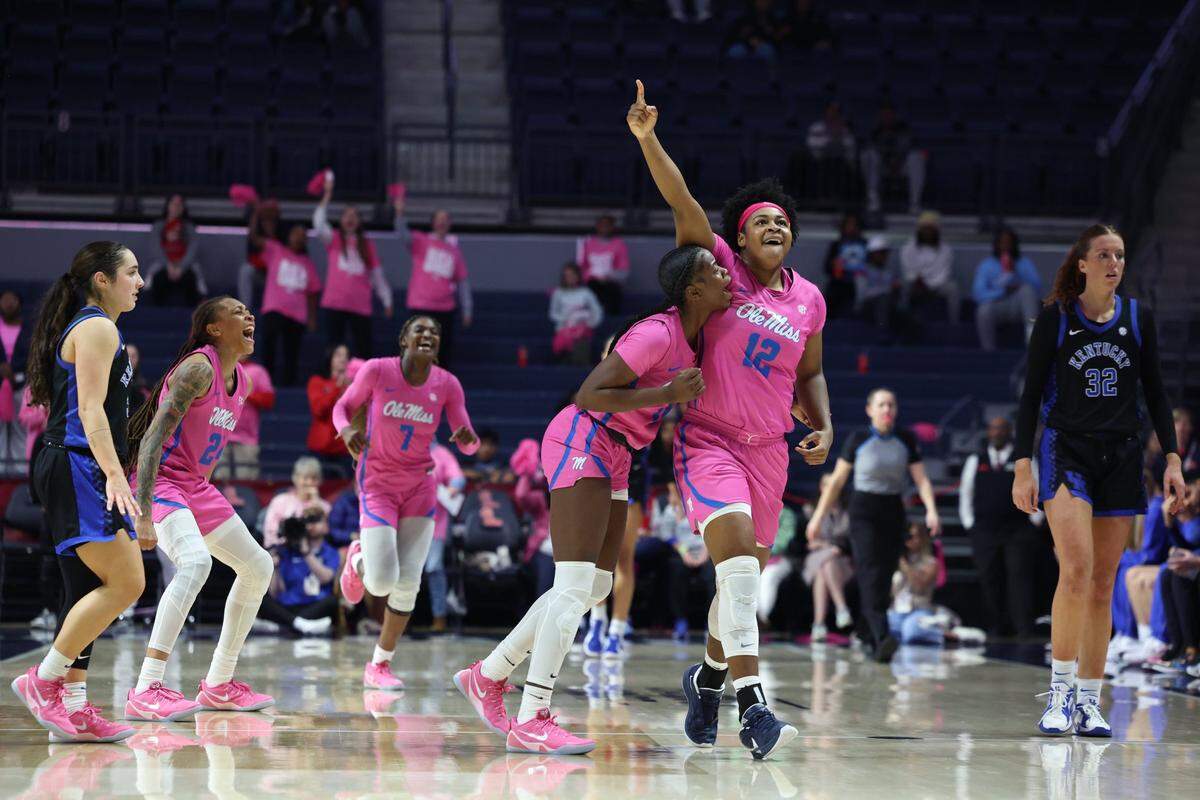 Christeen Iwuala leads Ole Miss in celebration after its upset of No. 8 Kentucky in Oxford on Monday night. Iwuala finished with eight points and five rebounds.