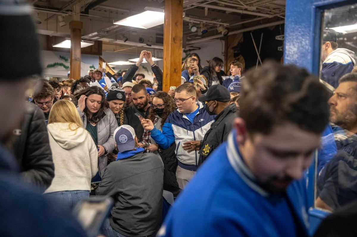 Fans begin lining up at about 9 p.m. before a midnight ice hockey game between the University of Kentucky and University of Louisville.