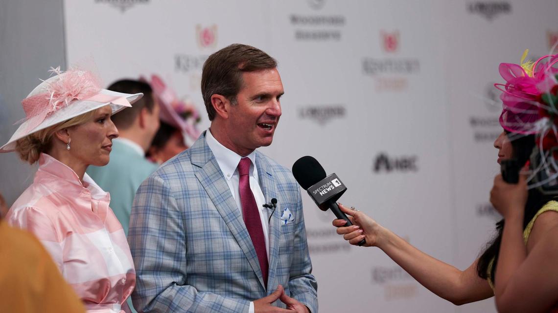 Gov. Andy Beshear speaks to media at the Kentucky Derby Red Carpet on Saturday, May 3, 2025, at Churchill Downs in Louisville, Kentucky.