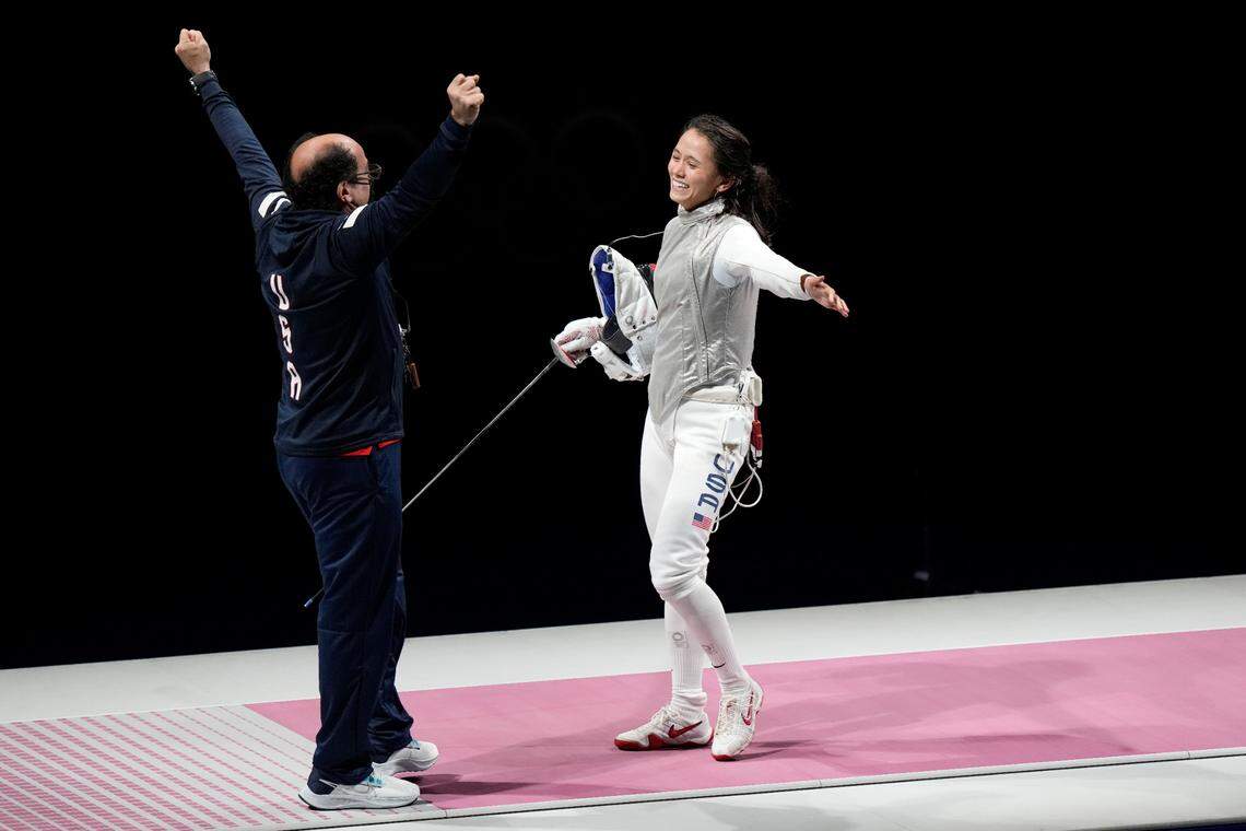American Lee Kiefer, right, celebrated with her coach, Amgad Khazbak, after winning the gold medal in the women’s individual foil competition at the Summer Olympics on Sunday in Chiba, Japan.