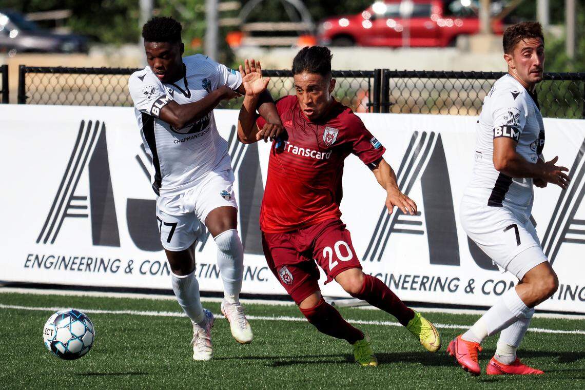 Chattanooga Red Wolves SC forward Marky Hernandez (20) works between FC Tucson forward Shak Adams (77) and midfielder Roberto Alarcon (7) during a USL League One match in East Ridge, Tenn., last season.
