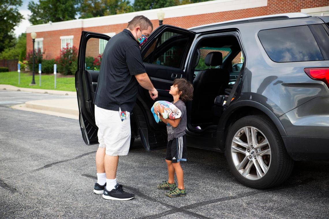 Jason Thomas drops off his son, Lincoln, 5, at Central Baptist Church Childcare Center in Lexington, Ky., on Friday, August 7, 2020. CBCCC permanently closed on Friday and is one of many childcare centers that are closing due to reasons caused by the COVID-19 pandemic.