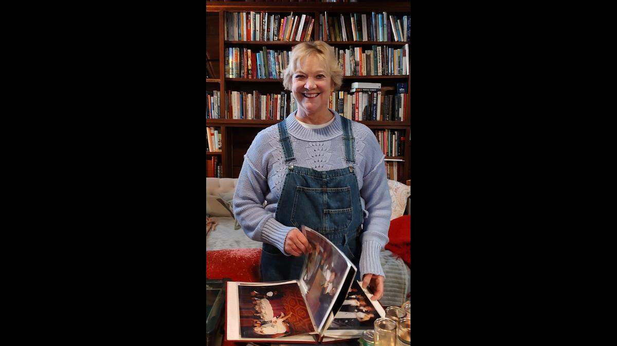 Erin Chandler looked through old family photos at her home in Versailles.