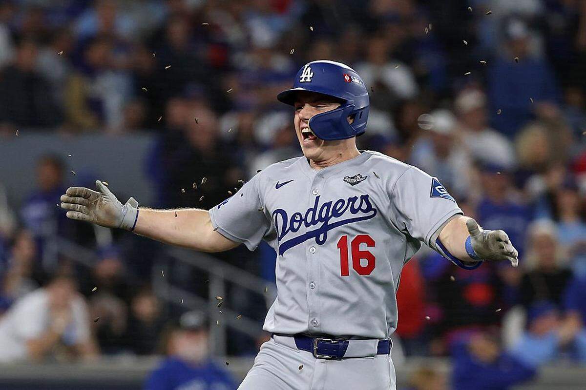 Los Angeles Dodgers catcher Will Smith (16), an alumnus of Kentucky Country Day High School and the University of Louisville, celebrated  after hitting the 11th-inning home run in the Game 7 of the World Series that, ultimately, gave L.A. a 5-4 game win and a 4-3 series victory over the Toronto Blue Jays. 