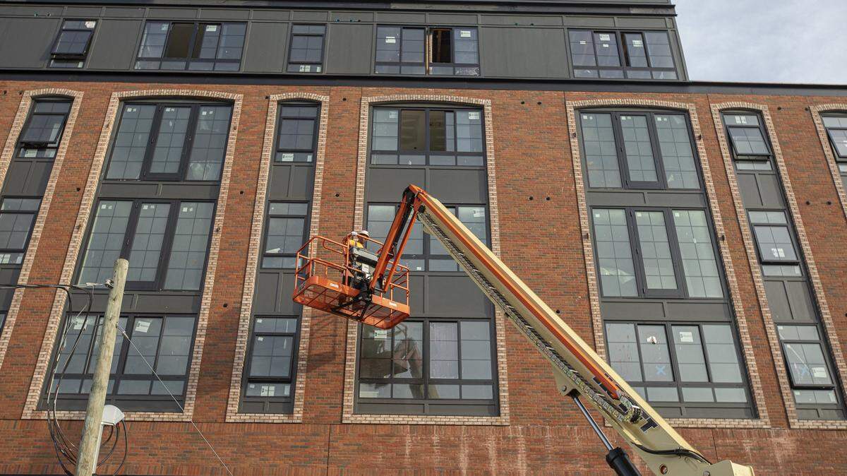 Ben Richard, of HB Masonry, prepares to clean the bricks at 500 S. Upper, site of a new Target, on Friday, May 17, 2019.