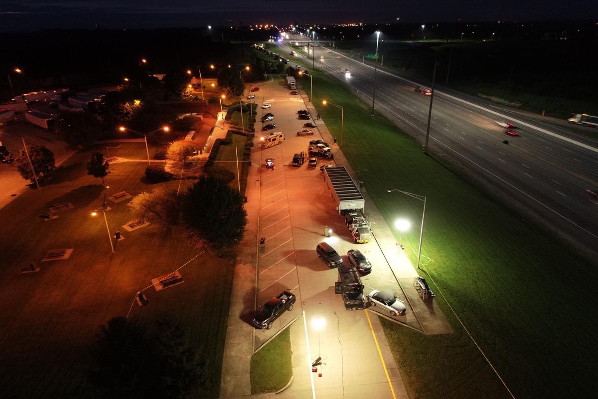 In this overhead photo from the night of the shooting, the suspect’s silver Mustang convertible is bottom right with a police special-response team vehicle at the rear of the Mustang. The shooting left a Scott County deputy paralyzed and the suspect, Edward Reynolds, dead.
