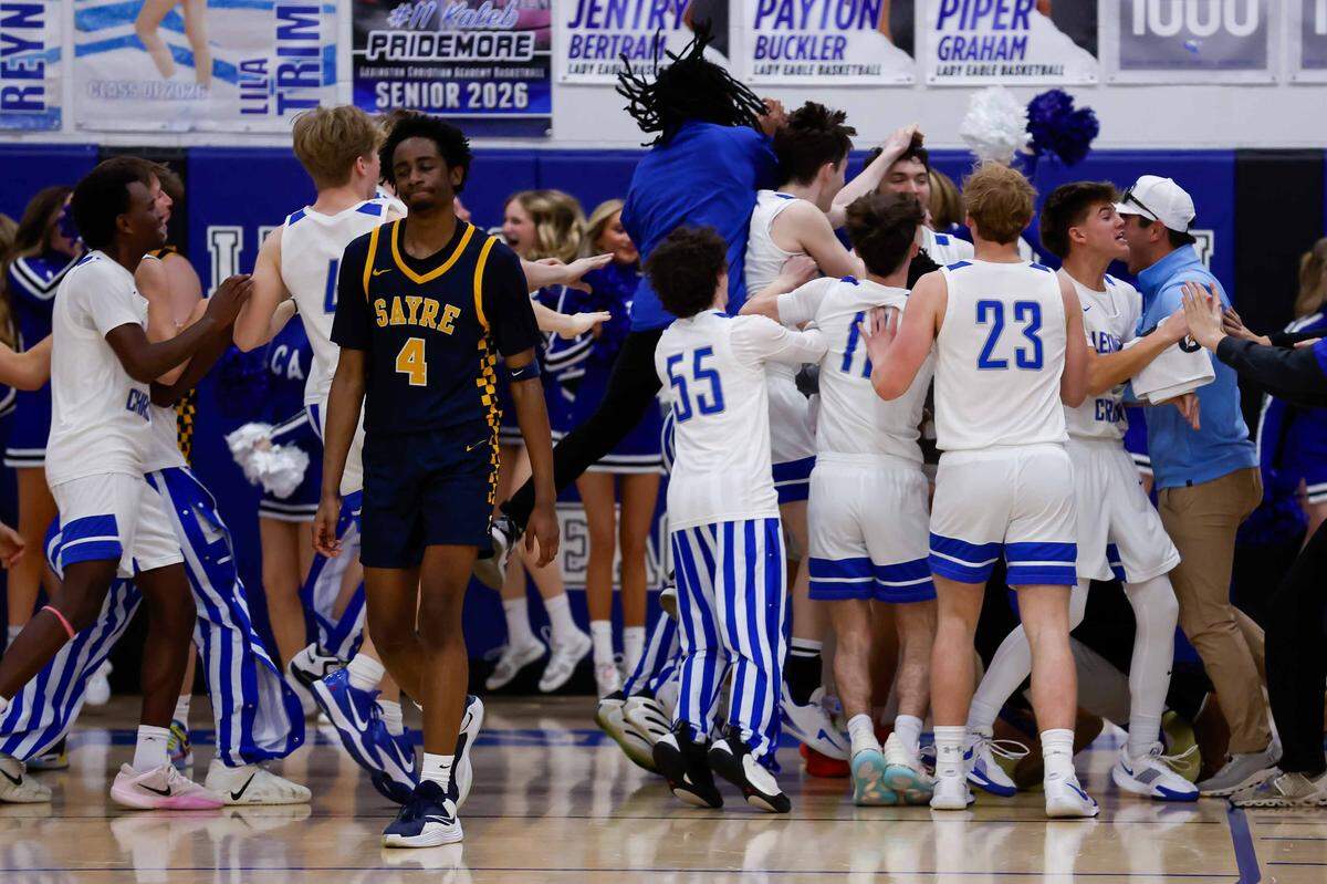 Lexington Christian celebrates after Dawson Farmer (0) made the game winning lay up during a high school boys basketball game, on Saturday, Jan. 17, 2026.