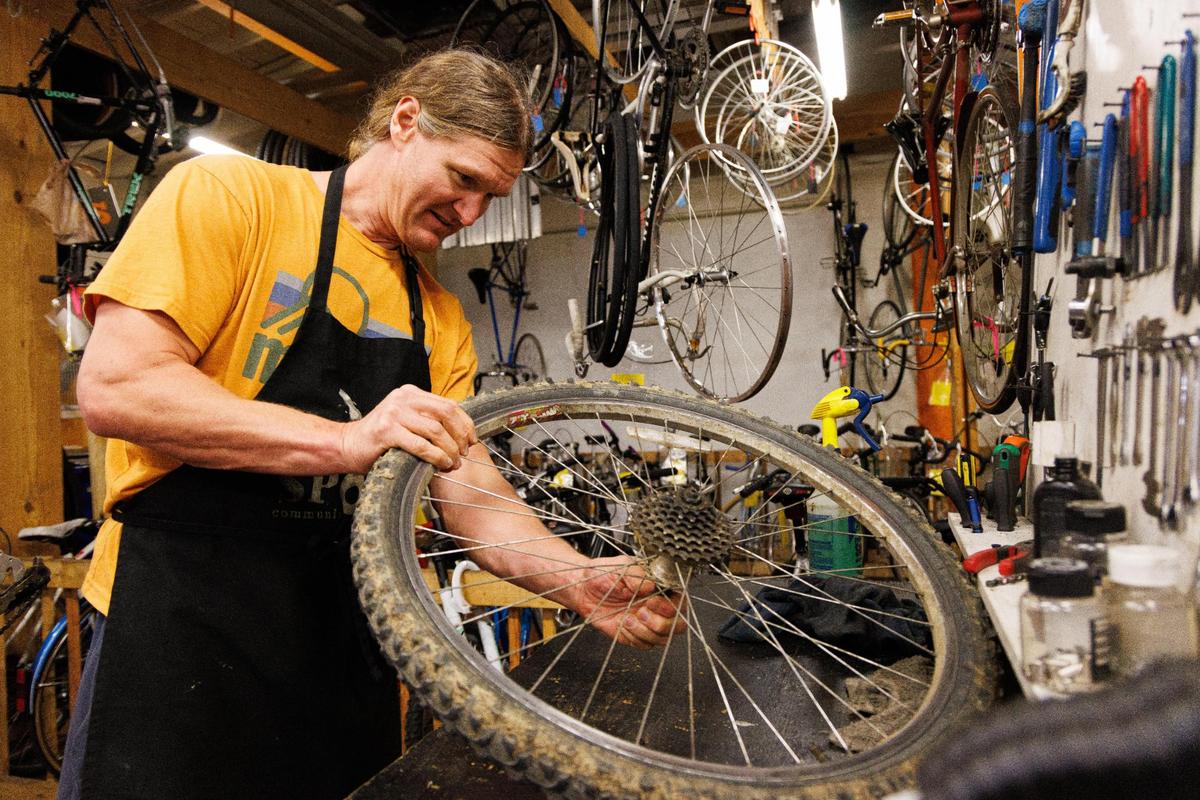 Jimmy Fox uses a work station he rented to work on a bicycle on Sunday, May 22, 2022, at Broke Spoke Community Bike Shop in Lexington, Kentucky.