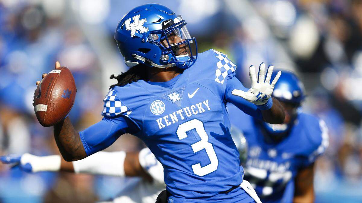 Kentucky Wildcats quarterback Terry Wilson was hit illegally by a Louisville player Saturday.