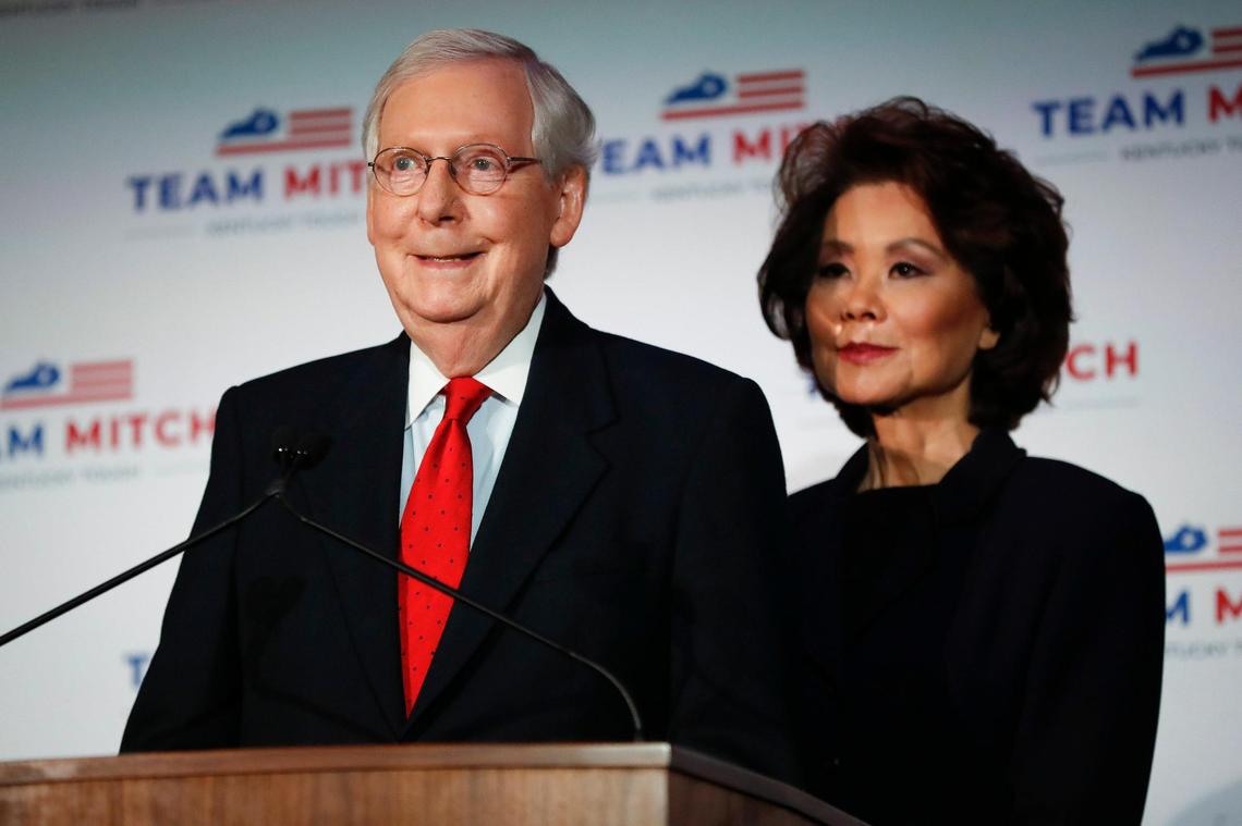 Republican Senate Majority Leader Mitch McConnell, standing with his wife Elaine Chao, gives remarks after winning reelection over Democratic challenger Amy McGrath at the Omni Hotel in Louisville, Ky., Tuesday, Nov. 3, 2020.