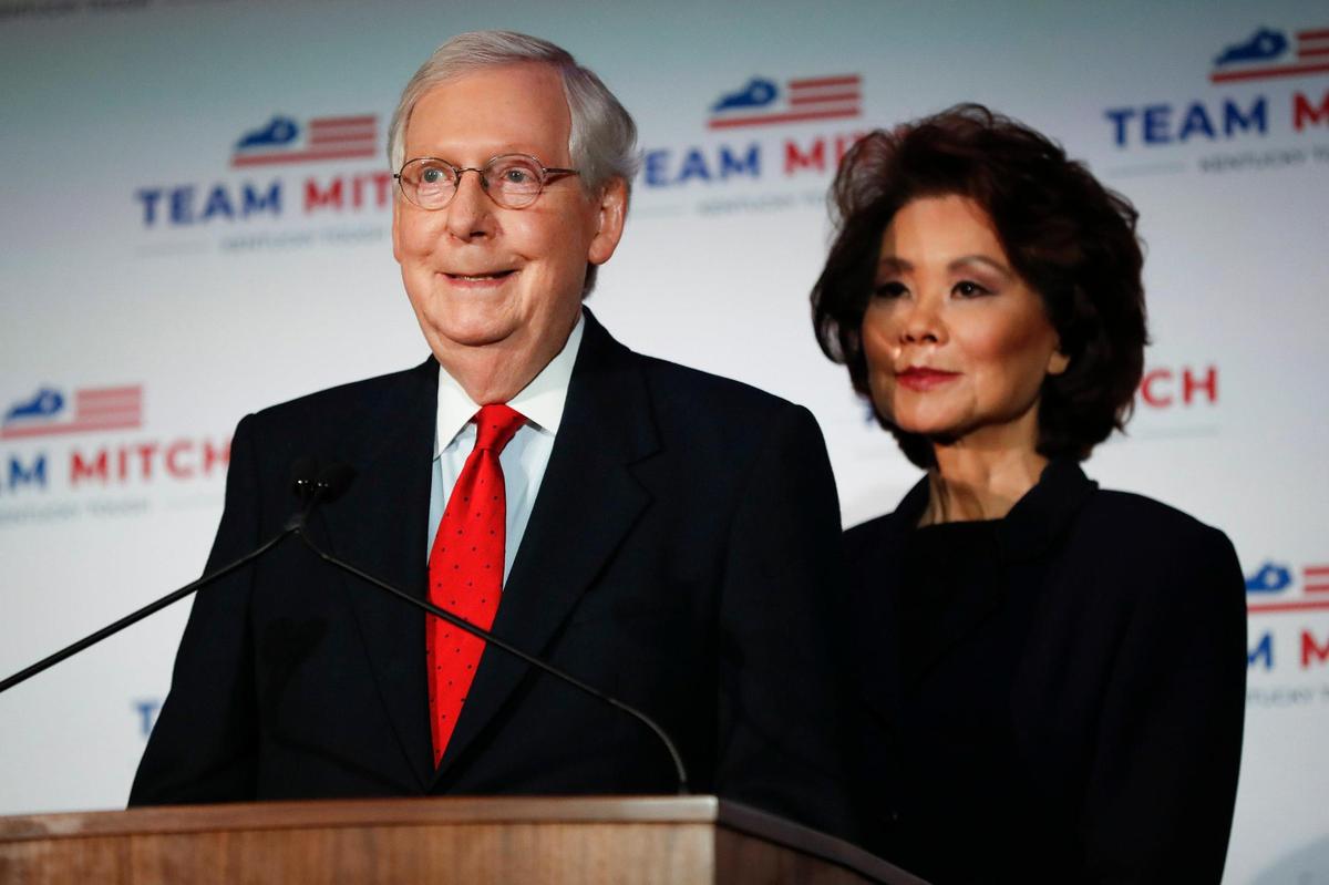 Republican Senate Majority Leader Mitch McConnell, standing with his wife Elaine Chao, gives remarks after winning reelection over Democratic challenger Amy McGrath at the Omni Hotel in Louisville, Ky., Tuesday, Nov. 3, 2020.