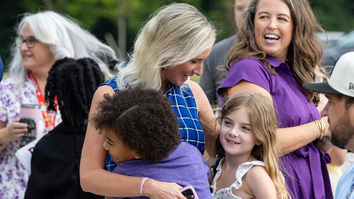 Future students of the new Rise STEM Academy for Girls embrace their prospective faculty and staff before the schools ribbon-cutting program on August 3, 2026, in Lexington, Ky. FCPS celebrated the opening of the new facility with special guests, including Lt. Gov. Jacqueline Coleman and Mayor Linda Gorton, as students recited the student creed and provided building tours.