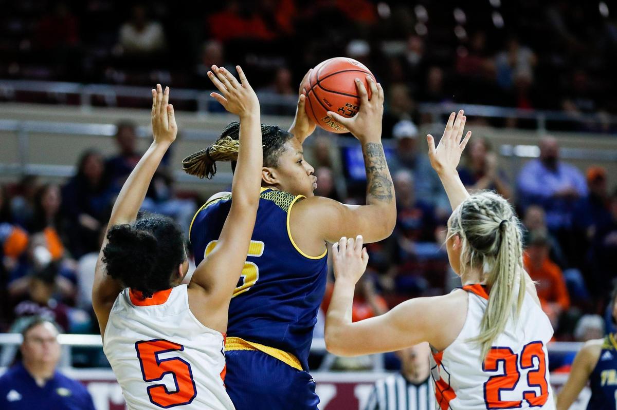 Franklin County’s Patience Laster (35) grabbed a rebound between two Madison Southern players during the Girls’ 11th Region Tournament semifinals game at Eastern Kentucky University’s McBrayer Arena in Richmond on Thursday, March 3, 2022.