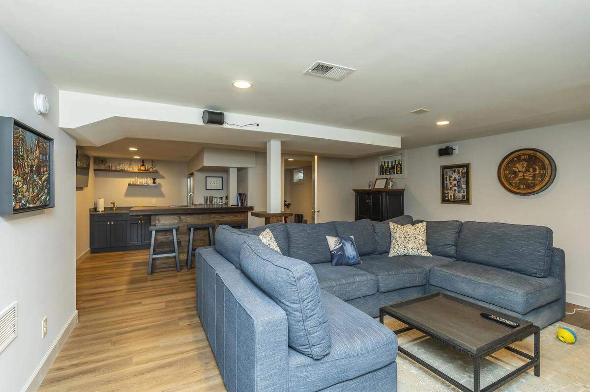 The basement den at 403 Queensway Drive, complete with a bourbon bar.