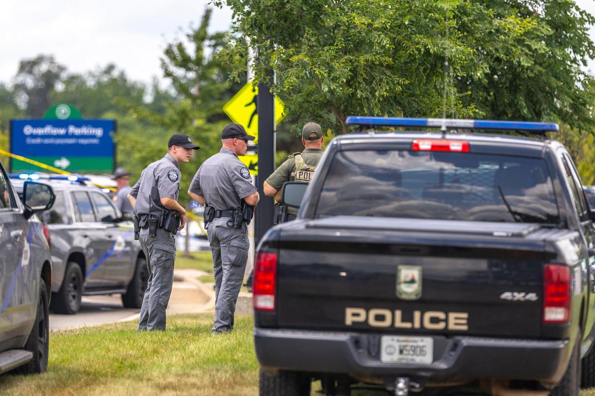 Law enforcement members respond to a shooting on Terminal Drive near the Blue Grass Airport in Lexington, Ky., on Sunday, July 13, 2025.