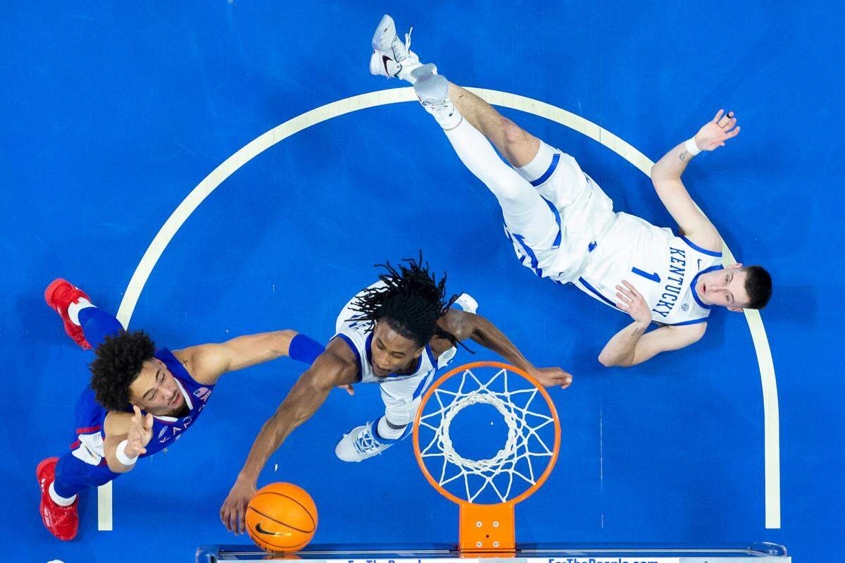 Kentucky Wildcats guard Cason Wallace (22) blocks a shot by Kansas Jayhawks forward Jalen Wilson (10) during the game at Rupp Arena in Lexington, Ky., Saturday, January 28, 2023. The reigning national champion Jayhawks survived a raucous Rupp Arena crowd what could have been coach Bill Self’s first four-game skid in 20 seasons as Jayhawks’ head coach. But Kansas No. 9 won, 77-68.