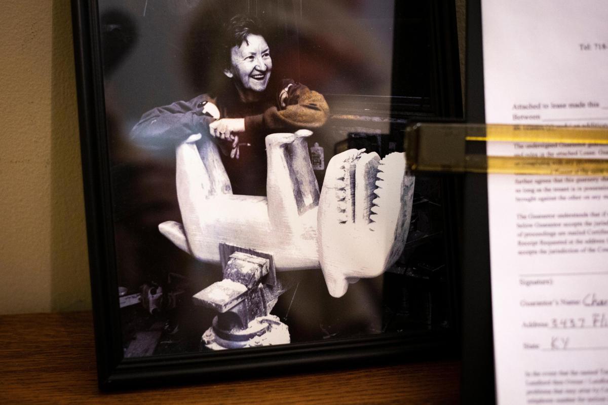 A photo of Minnie Adkins sits in Mike Norris’ Lexington home. The two have collaborated on multiple books where Adkins carves wooden characters to accompany Norris’s poetry.