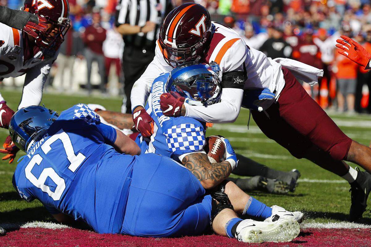 Kentucky left tackle Landon Young (67) and the rest of UK’s “Big Blue Wall” came up big on the game-deciding, final drive in the Wildcats’ 37-30 win over Virginia Tech in the Belk Bowl.