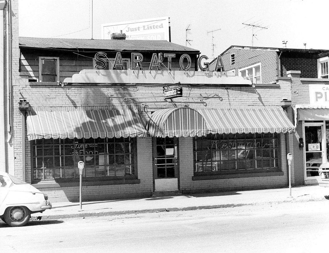 The Saratoga restaurant photographed April 10, 1978 at 856 East High Street was a Chevy Chase landmark and best known for its characters: bookies, college professors, socialites and city hall types. Totsie Rose opened it in 1953 and named it after the famous Saratoga Race Track in New York. Ted Mims owned it from 1977 to 1989. He bought it from Ed Whitlock, who had bought it from Rose. Rob Ramsey and Joe Reilly, co-owners of Ramsey’s Diner, owned it for a short time. A Toga menu, served from 10 p.m. to 1 a.m. Monday through Saturday, featured Mrs. McKinney’s snappy beer cheese ($2.95), fried bologna ($2.50), cold meatloaf on white ($4.95) and fried egg sandwich ($2.50). The hot plate special for a Derby weekend was chicken and dumplings for $6.95. Photo by John C. Wyatt | staff